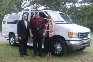 Dr. Bill Gothard and Mr. and Mrs. Wilson with their new van.